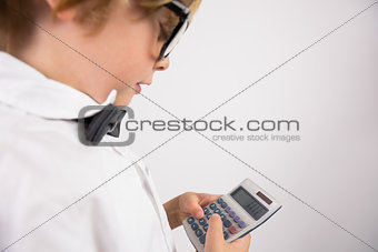 Student smiling and holding calculator