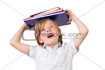 Student balancing books on his head