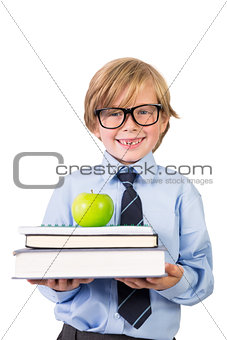 Student smiling with notebooks