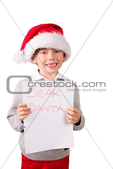 Child holding a letter to santa