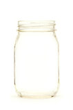 Empty glass jar against white