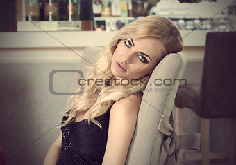 pretty woman sitting at table