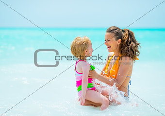 Portrait of mother and baby girl in sea