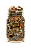 Glass jar overflowing with American coins