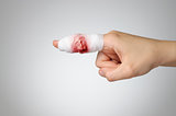 Injured finger with bloody bandage