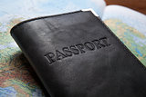passport in the bag on a map 