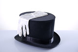 Black top hat with silk white gloves 