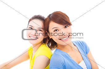 closeup of two happy young girls over white background