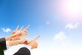 business people hands with blue sky background