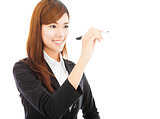 smiling business woman standing and holding a pencil