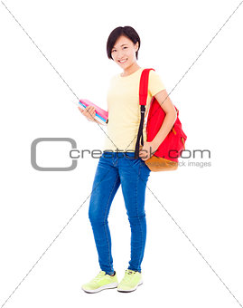 smiling young student girl standing and holding book