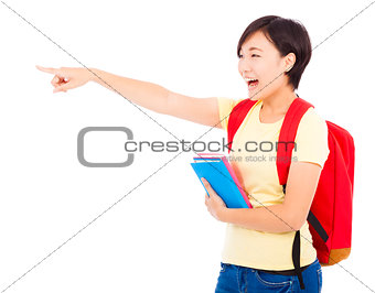 happy student girl holding book and pointing