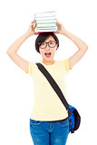 pretty university student girl holding book on the head