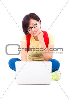 happy young student girl sitting with a laptop