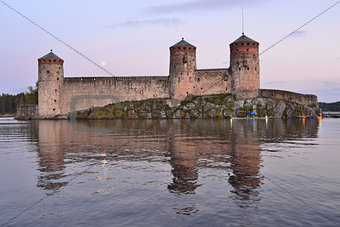 Savonlinna.  Fortress Olavinlinna at sunset