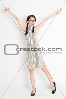 Asian Chinese girl arms outstretched 