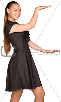 Woman holding big imaginary object between two hands