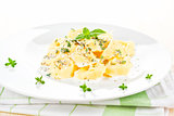 Tortellini with cheese sauce.