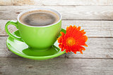 Coffee cup and gerbera flower