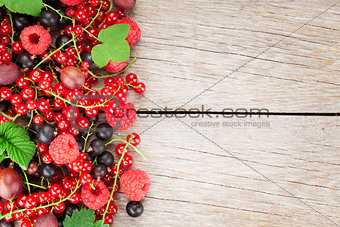Fresh ripe berries on wooden table
