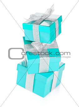 Three blue gift boxes with silver ribbon and bow