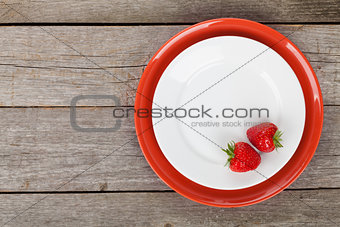 Plate with ripe strawberry