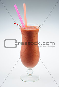 Berry smoothie with cherry over white background