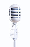White vintage microphone over white background