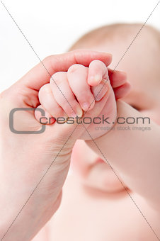 Mother massaging her baby 