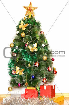 big Christmas tree with decorations and gifts