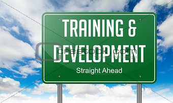 Training and Development on Highway Signpost.