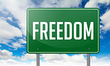 Freedom on Green Highway Signpost.