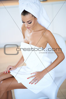 Woman Wearing White Bath Towel Sitting on Chair