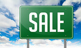 Sale on Green Highway Signpost.