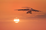 Landing of the plane at sunset.