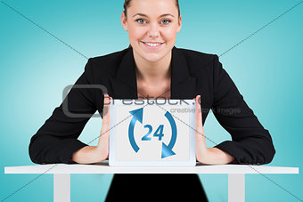 Composite image of businesswoman showing tablet pc
