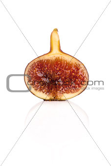 Half sliced fig isolated on white background