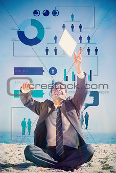 Composite image of victorious young businessman juggling with his tablet