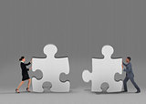 Composite image of business team standing and pushing