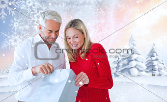 Composite image of loving couple with shopping bag