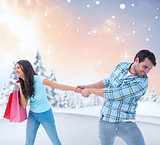 Composite image of happy couple with shopping bags