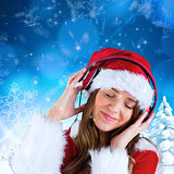 Composite image of sexy santa girl listening to music