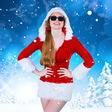 Composite image of cool santa girl wearing sunglasses