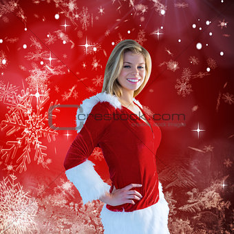 Composite image of pretty girl smiling in santa outfit