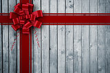 Composite image of red christmas bow and ribbon