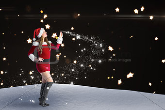 Composite image of sexy santa girl looking up