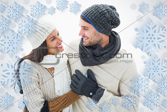 Composite image of attractive young couple in warm clothes