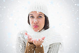 Composite image of pretty brunette blowing kiss to camera