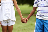 Children love black boy white girl holding hands