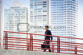 Chinese asian office worker walking commuting work
